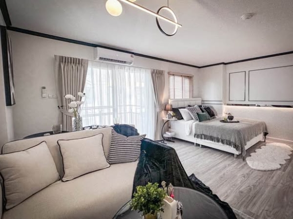living room and bedroom of The Escape Condominium – ดิ เอสเคป คอนโดมิเนียม