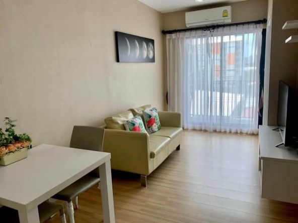 bedroom and living room of Dezone Condo
