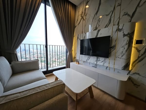 bedroom and living room of Noble Around Ari