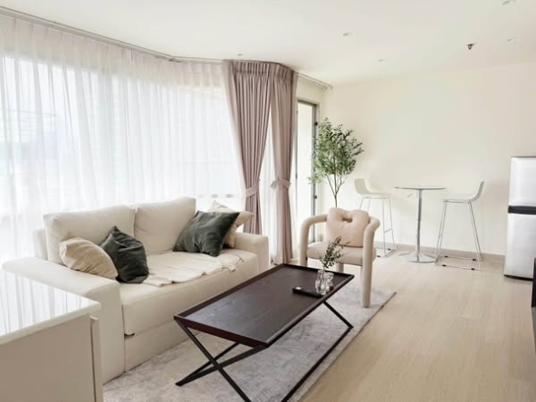 bedroom and living room of Sukhumvit Suites Hotel