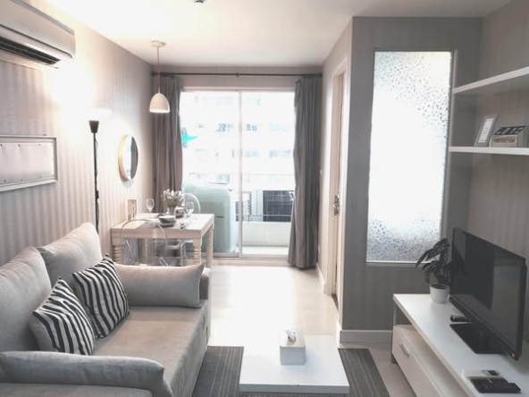 bedroom and living room of The Clover