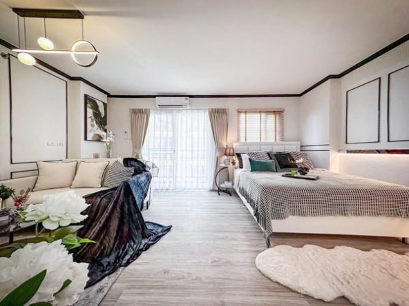 bedroom and living room of The Escape Condominium – ดิ เอสเคป คอนโดมิเนียม
