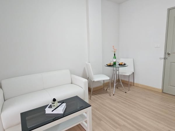bedroom and living room of THE KITH CHAENGWATTANA